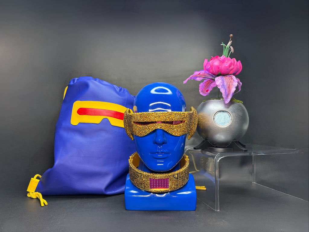 Full Cyclops cosplay loot bundle featuring an X-Men '97 rhinestone visor, gold collar, blue faux leather drawstring bag, and a Krakoan flower pod replica.