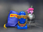 Full Cyclops cosplay loot bundle featuring an X-Men '97 rhinestone visor, gold collar, blue faux leather drawstring bag, and a Krakoan flower pod replica.
